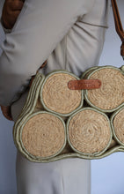 Load image into Gallery viewer, Handmade banana fibre bag with coiled detailing and adjustable leather shoulder strap.